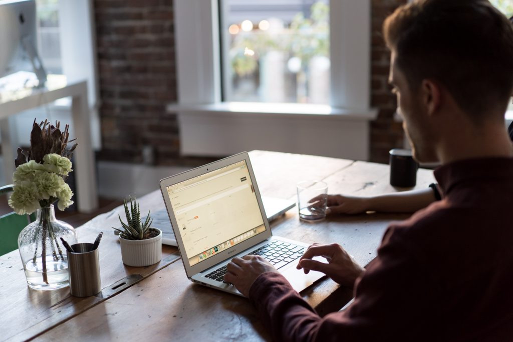 white man on computer