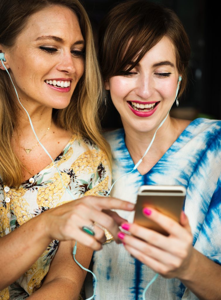 girls listening to music on phone