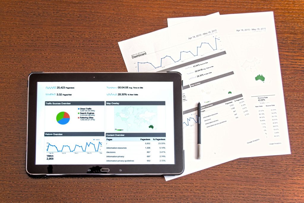 computer-tablet-and-pieces-of-paper