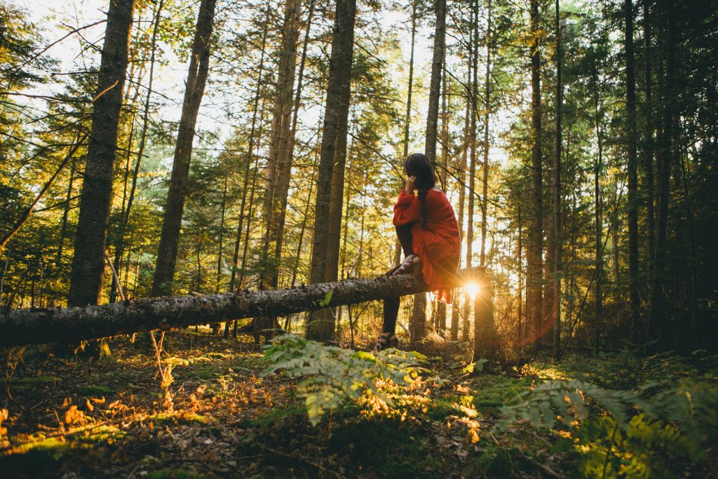 woman-seated-in-forest